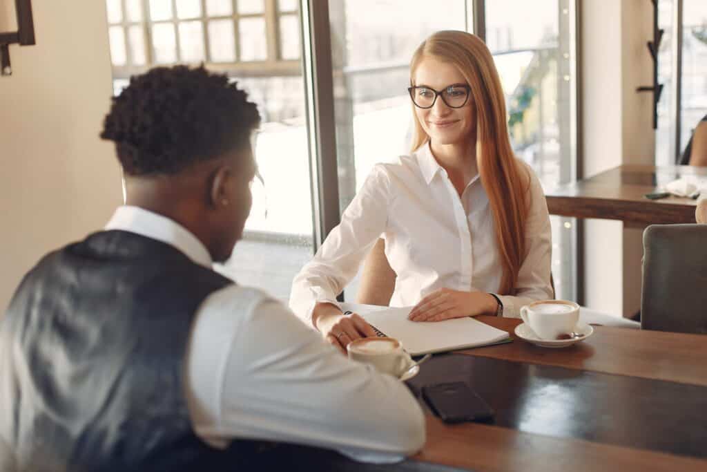 A woman interviewing a man for a job brianvanderwaal.com/interview-tips