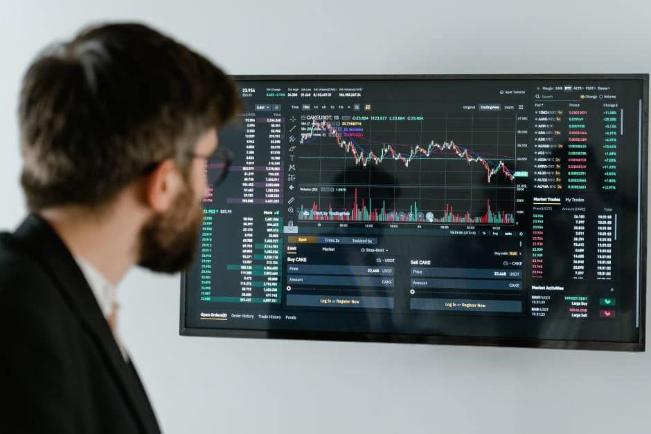 An image of an Operations Research Analysts / Data Analyst looking at a large screen of data.