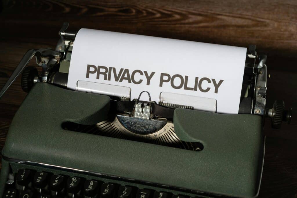 An image of a typewriter with a document that says "Privacy Policy" in the typewriter.